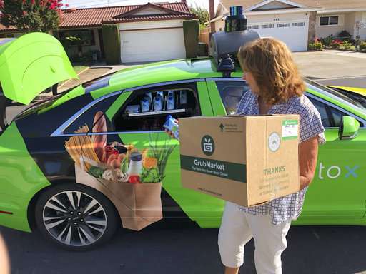 Humans still heft groceries on-demand, for now
