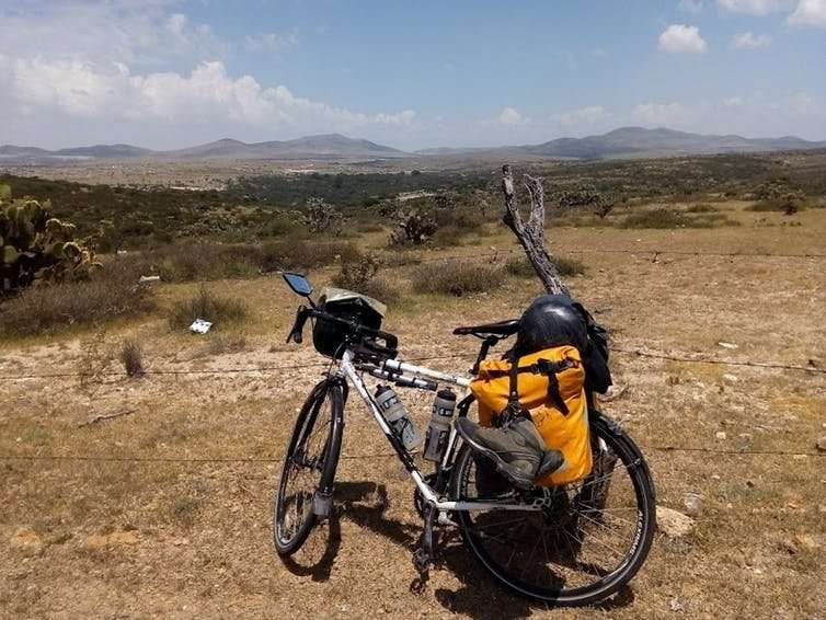 Why I quit my day job researching happiness and started cycling to Bhutan
