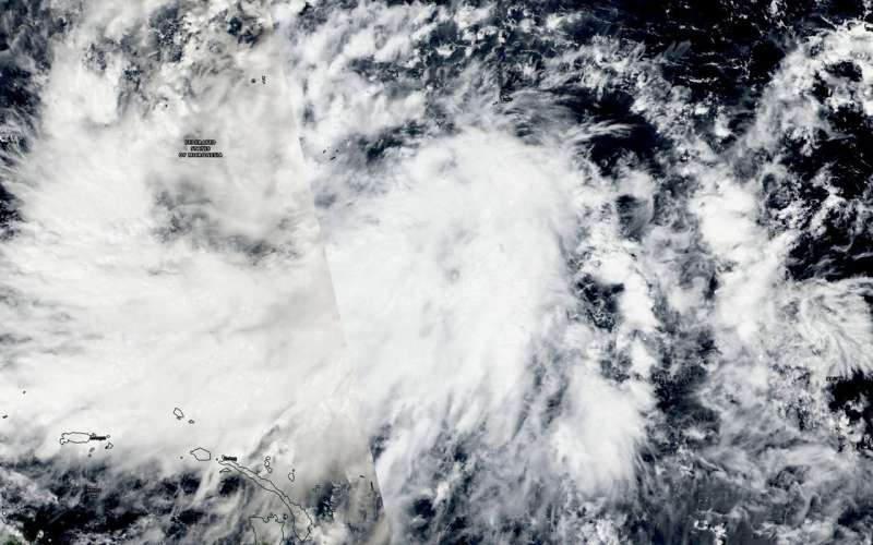 NASA sees Tropical Depression Man-yi, warnings triggered