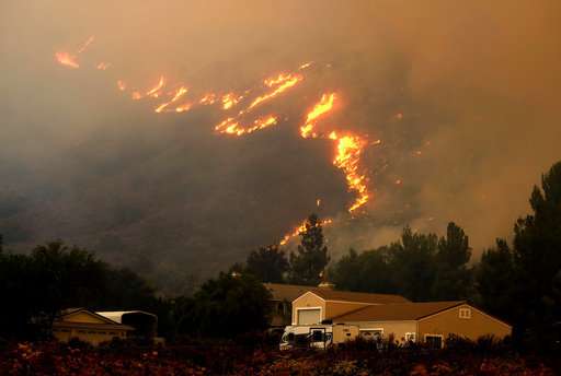 California crews scramble to keep flames from reaching homes