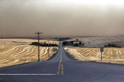 Oregon wheat farmers try to stop fire that's consuming crops
