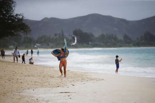 Powerful Hawaii hurricane downgraded to tropical storm