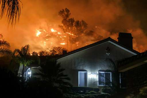 California crews scramble to keep flames from reaching homes