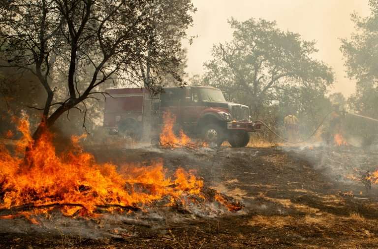 Firefighters in Shasta County, northern California warn &quot;erratic winds&quot; have caused the Carr Fire to spread