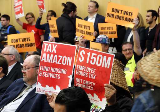 Seattle OKs taxing companies like Amazon to aid the homeless