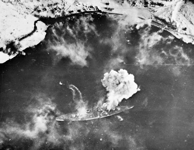 A 1944 picture shows smoke rising from the Tirpitz following an attack by allied bombers in a Norwegian fjord