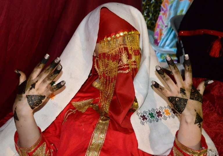 A bride shows her henna-painted hands, the day before her wedding in Gabes, Tunisia