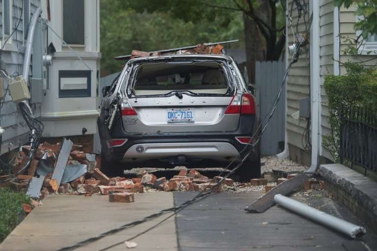 A car destroyed by falling bricks as Hurricane Florence passes over Wilmington, North Carolina