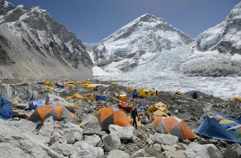 A climber walks through base camp below Everest, which is suffering from a dangerous shortage of its most important resource: ex
