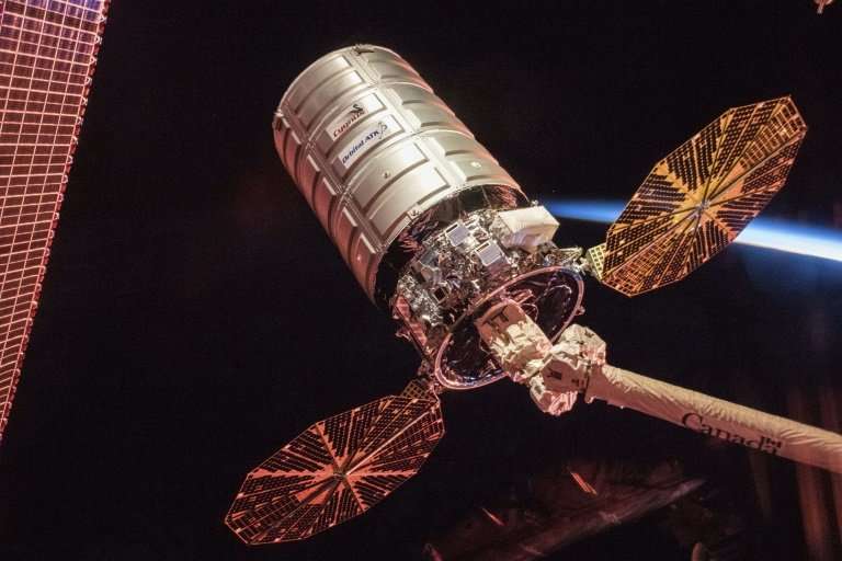 A Cygnus cargo vessel latched on to the International Space Station before its detachment