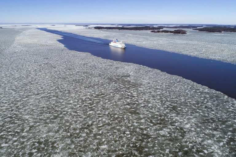A ferry sails through the melting ice near Vaasa in western Finland