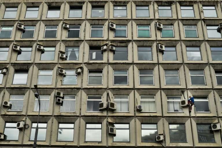 Air conditioners on a building in Moscow, part of a worldwide demand for cooling systems that is expected to tripple over the ne