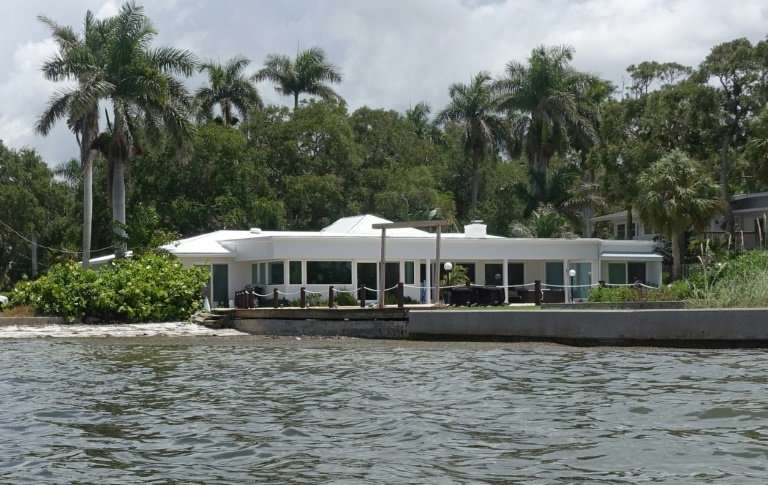 A low-lying home near sea level in the Indian Beach neighborhood of Sarasota, Florida, a state where tens of thousands of coasta