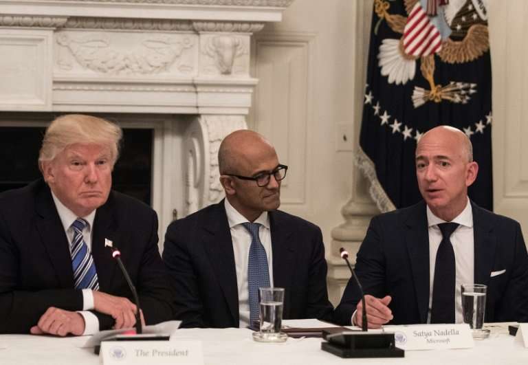 Although he opposed Donald Trump in the 2016 campaign, Amazon CEO Jeff Bezos, seen at right next to Microsoft CEO Satya Nadella,