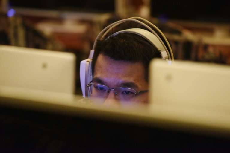 A man uses a computer in an internet cafe in Beijing: China is tightening controls by curbing the use of VPNs