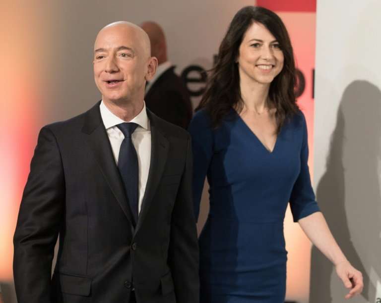 Amazon CEO and founder Jeff Bezos, seen with his wife MacKenzie Bezos, has become the world's richest person based on his compan