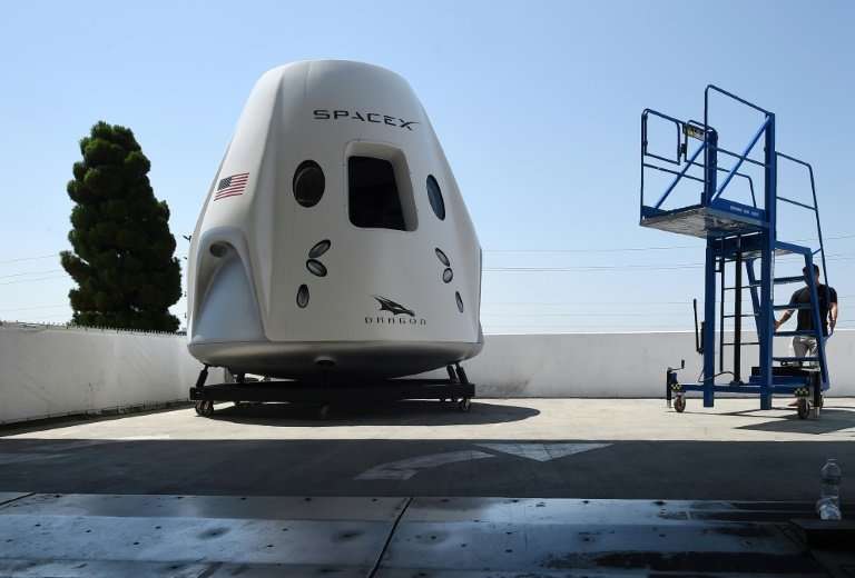 A mock up of the Crew Dragon spacecraft is displayed during a media tour of SpaceX headquarters and rocket factory in Hawthorne,