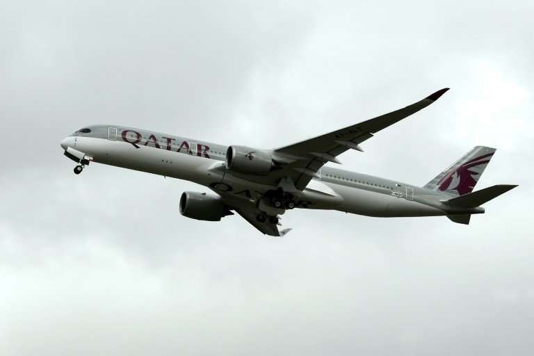 An A350 of Qatar Airways is pictured on October 19, 2017, after taking off from the Toulouse-Blagnac airport, near Toulouse