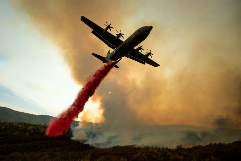 An air tanker drops retardant on the Ranch Fire, part of the Mendocino Complex