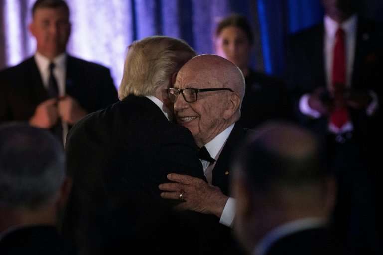 Analysts say it would be troublesome if mergers involving friends of Donald Trump such as Rupert Murdoch, seen with the presiden