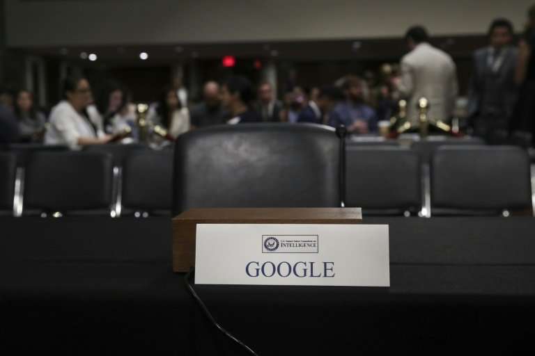 An empty seat for Google is seen during a Senate Intelligence Committee hearing concerning foreign influence operations' use of 