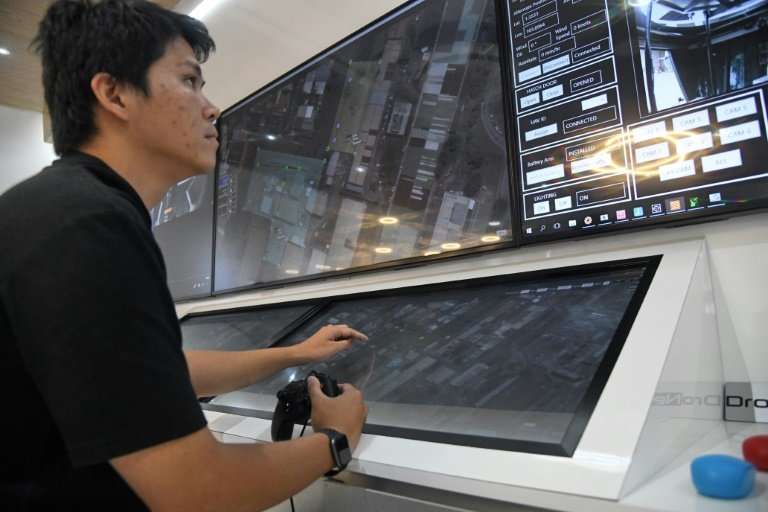 An engineer monitors a live video feed sent by a surveillance drone at a command centre in Singapore