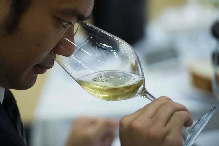 An expert tastes wine during the 2018 Concours Mondiale de Bruxelles at a hotel resort in Beijing