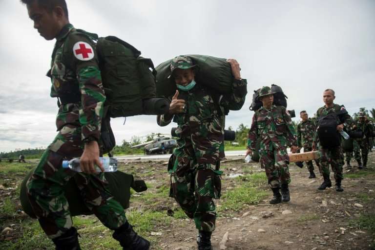 An Indonesian military medical team arrives in Agats, West Papua, as the impoverished region grapples with a deadly measles-and-