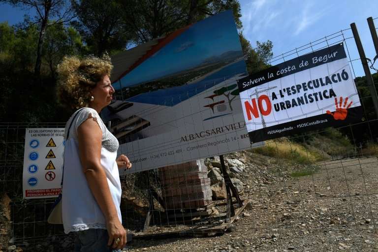 A poster against property speculation at a construction site in S'Antiga near the Platja de Pals or Beach of Pals on the Costa B