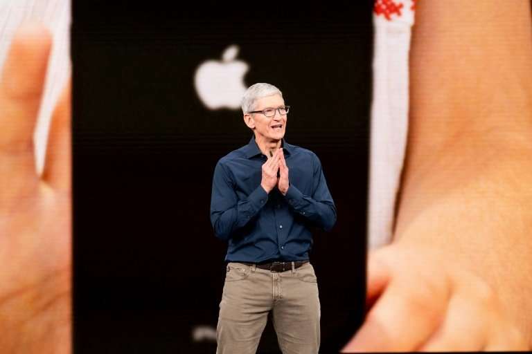 Apple, whose CEO Tim Cook is seen here at the September 12 iPhone launch event, won't face an immediate impact from new tariffs 
