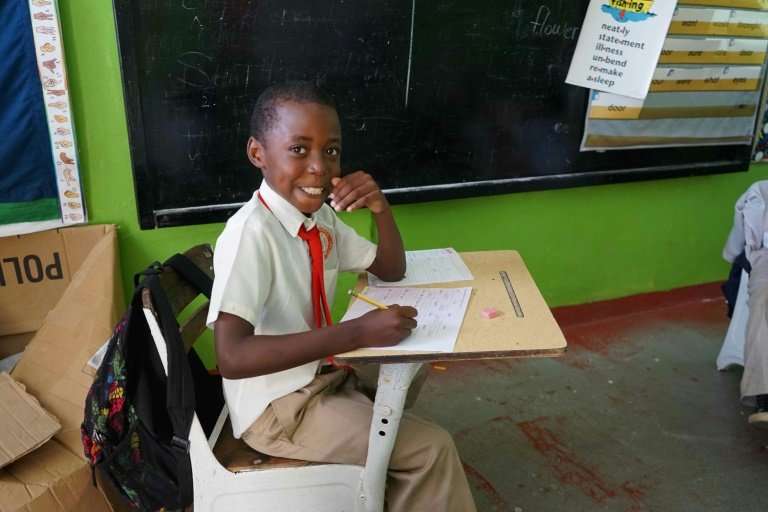 A pupil at Lighthouse Christian Academy in Atkinson, where electricity was yet to be restored