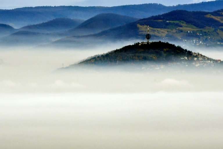 A ring of mountains helps trap the smog in valleys, shrouding Sarajevo residents in a grey fog