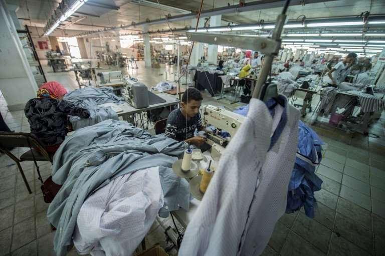 A tailor sews cotton shirts at the Marie Louis clothing and textile factory in the 10th of Ramadan city, about 60 kilometres nor
