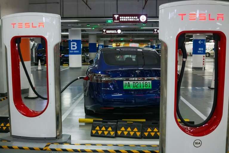 A Tesla vehicle is parked at a charging station inside a mall in Shanghai on October 23, 2017; the electric carmaker has diclose