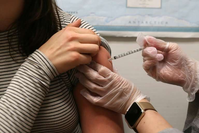 A woman gets a flu shot in California. A vocal minority of advocates are refusing shots, claiming that vaccines can be dangerous