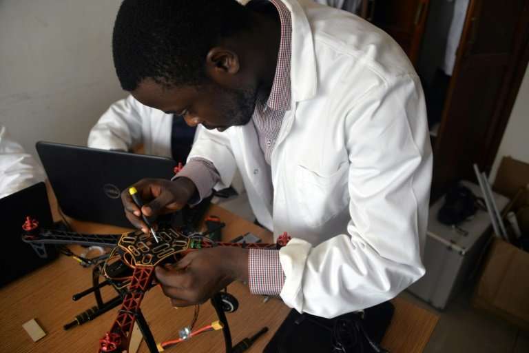 A young engineer works on making a drone entirely built in Cameroon at the Will &amp; Brothers company premises in Douala