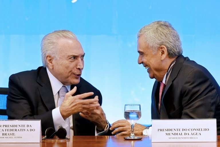 Brazilian President Michel Temer (L), seen here talking to the president of the World Water Council, Benedito Braga, is hosting 