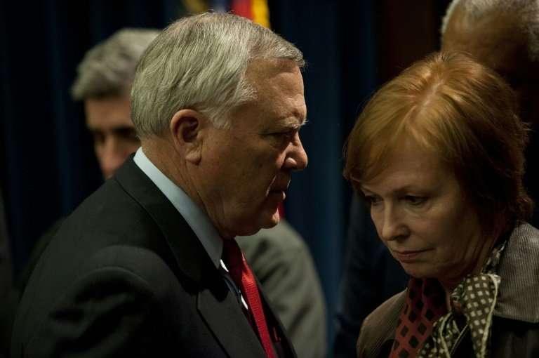 Brenda Fitzgerald (R), seen here in a 2014 file picture with Georgia Governor Nathan Deal (L), has resigned as head of the Cente