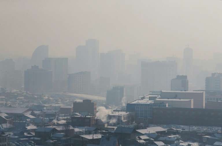 Buildings disappear in the smog in Ulaanbaatar, where residents have resorted to sipping 'lung' tea and 'oxygen cocktails' in a 