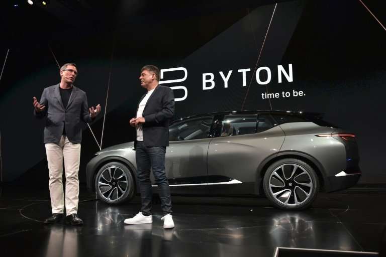 Byton president Daniel Kirchert, left, and CEO Carsten Breitfeld show the Byton connected car during CES 2018 in Las Vegas