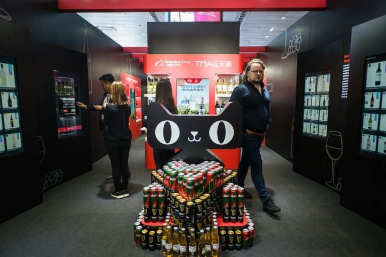 Customers browsed a pop-up shop stacked with wine bottles, billed by Alibaba as a way to show off its latest smart tech to retai