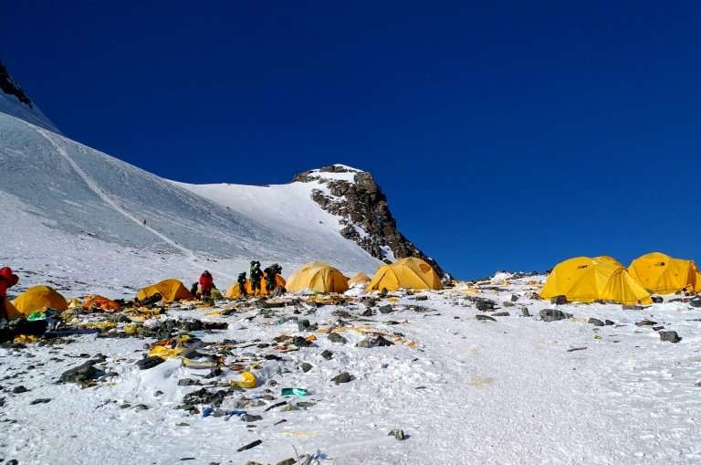 Discarded climbing equipment and rubbish scattered around Camp 4 of Mount Everest, where decades of commercial mountaineering ha