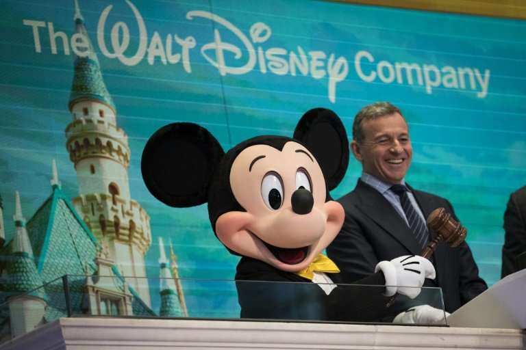 Disney CEO chief Bob Iger—shown here with Mickey Mouse preparing to ring the opening bell at the New York Stock Exchange in Nove