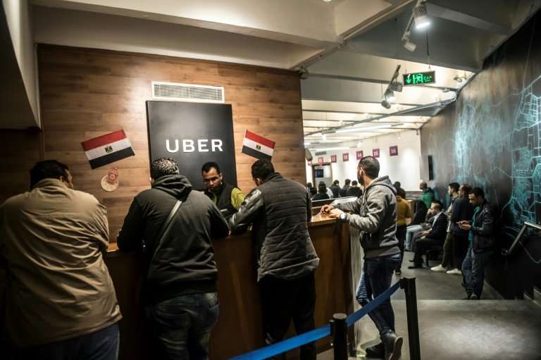 Drivers working for Uber meet at the company's Egyptian headquarters in Cairo