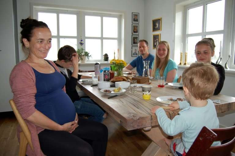 Faroe Islander Gunnhild Helmsdal (L) is awaiting the birth of her fourth child which will bring her family up to seven, includin