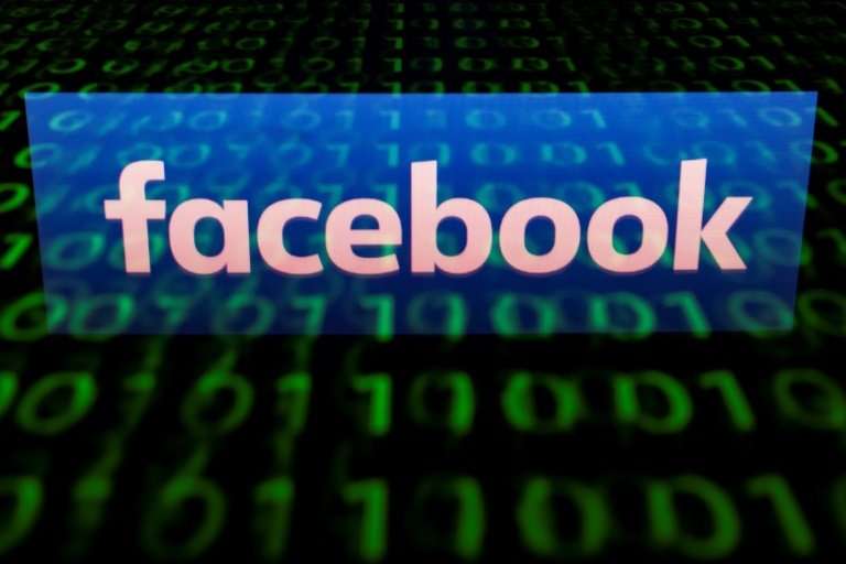 (FILES)  A file illustration picture taken on April 28, 2018 shows the logo of social network Facebook displayed on a screen and