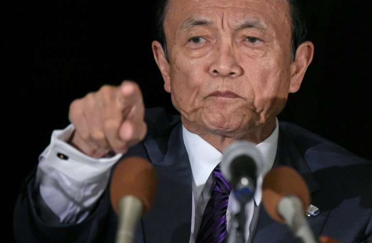 Finance Minister Taro Aso said the raids were being carried out on exchanges to &quot;examine their internal governance structur