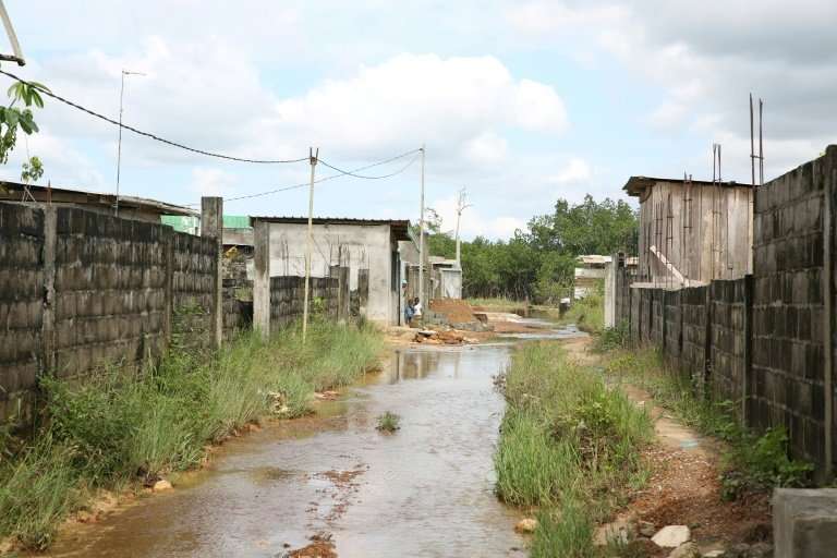 Flooded roads in a district of Libreville where houses have been built without coherent planning