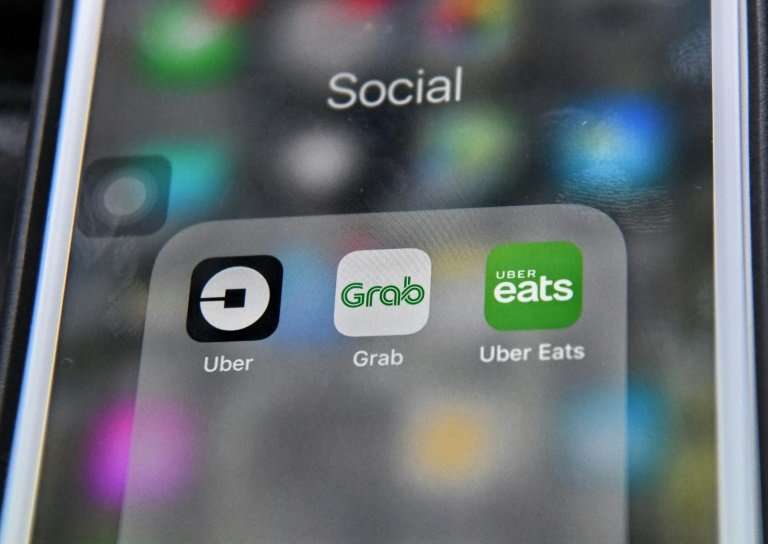 Grab agreed to buy Uber's food- and ride-hailing operations in Southeast Asia, giving the US firm a 27.5 percent stake in return