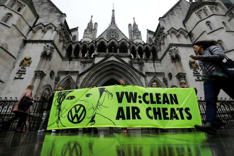 Greenpeace supporters held a protest against Volkswagen over the emissions scandal as a hearing got under way in London